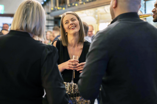 People laughing with drinks